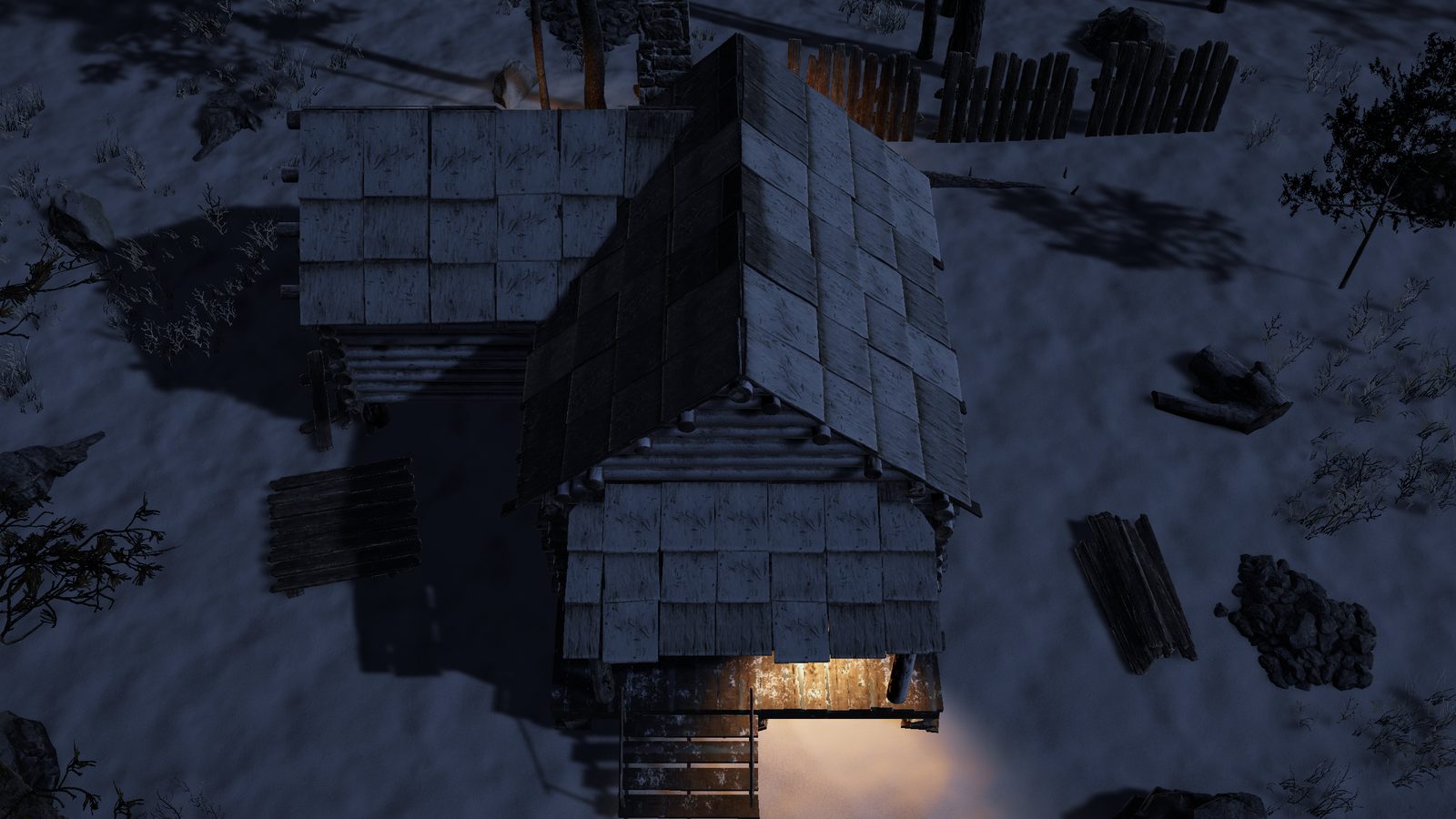 A log cabin at night, warm light from its stove spilling out of the doorway onto the snow.