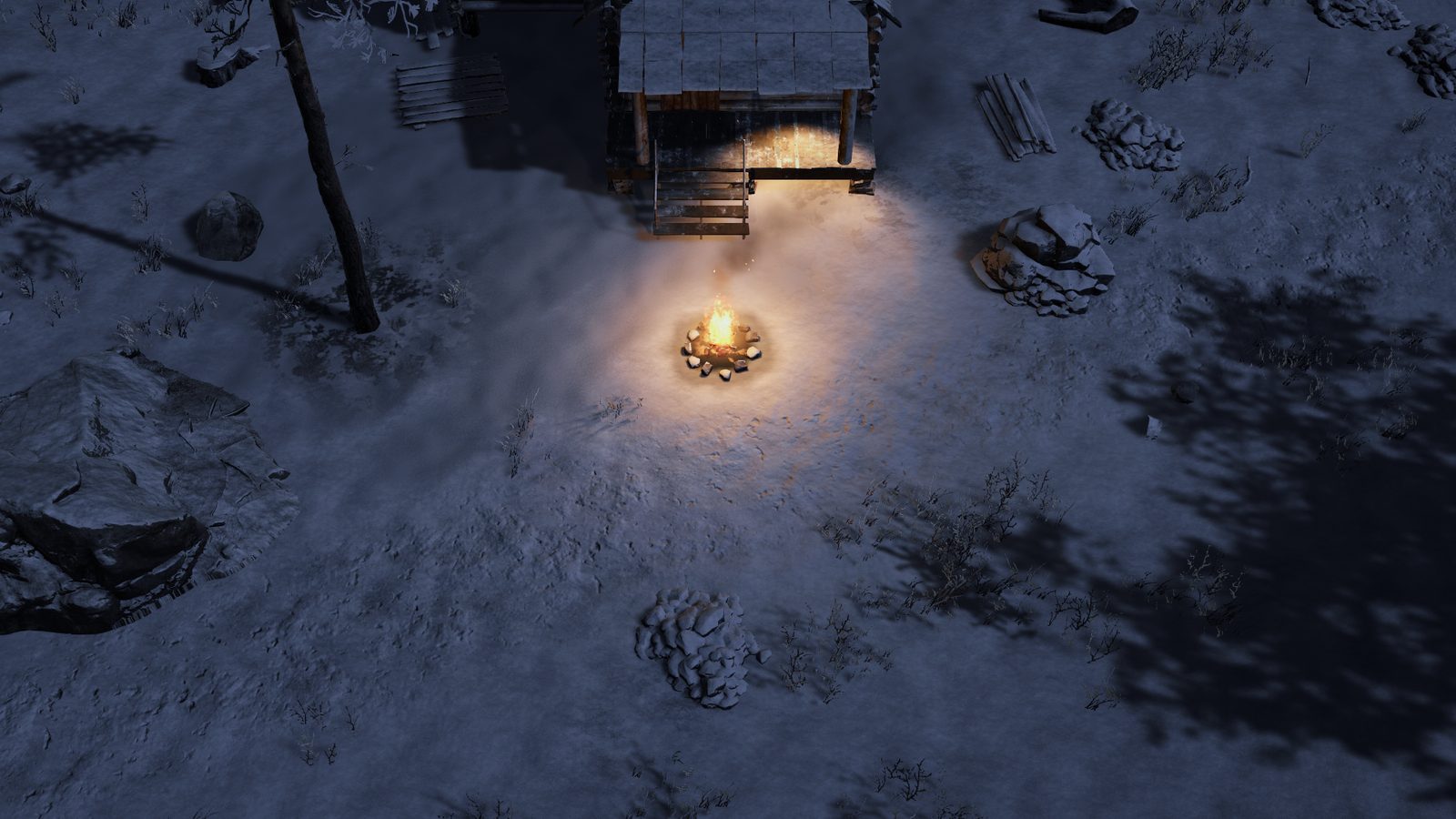 A clear night by the cabin: the campfire burning, warm light on the porch, and moonlit snow with tree shadows all around.