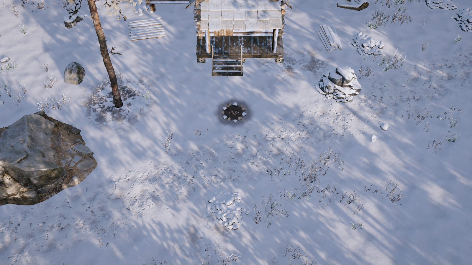 Sunlit snow by the cabin, long blue tree shadows, a boulder and a cold fire ring.